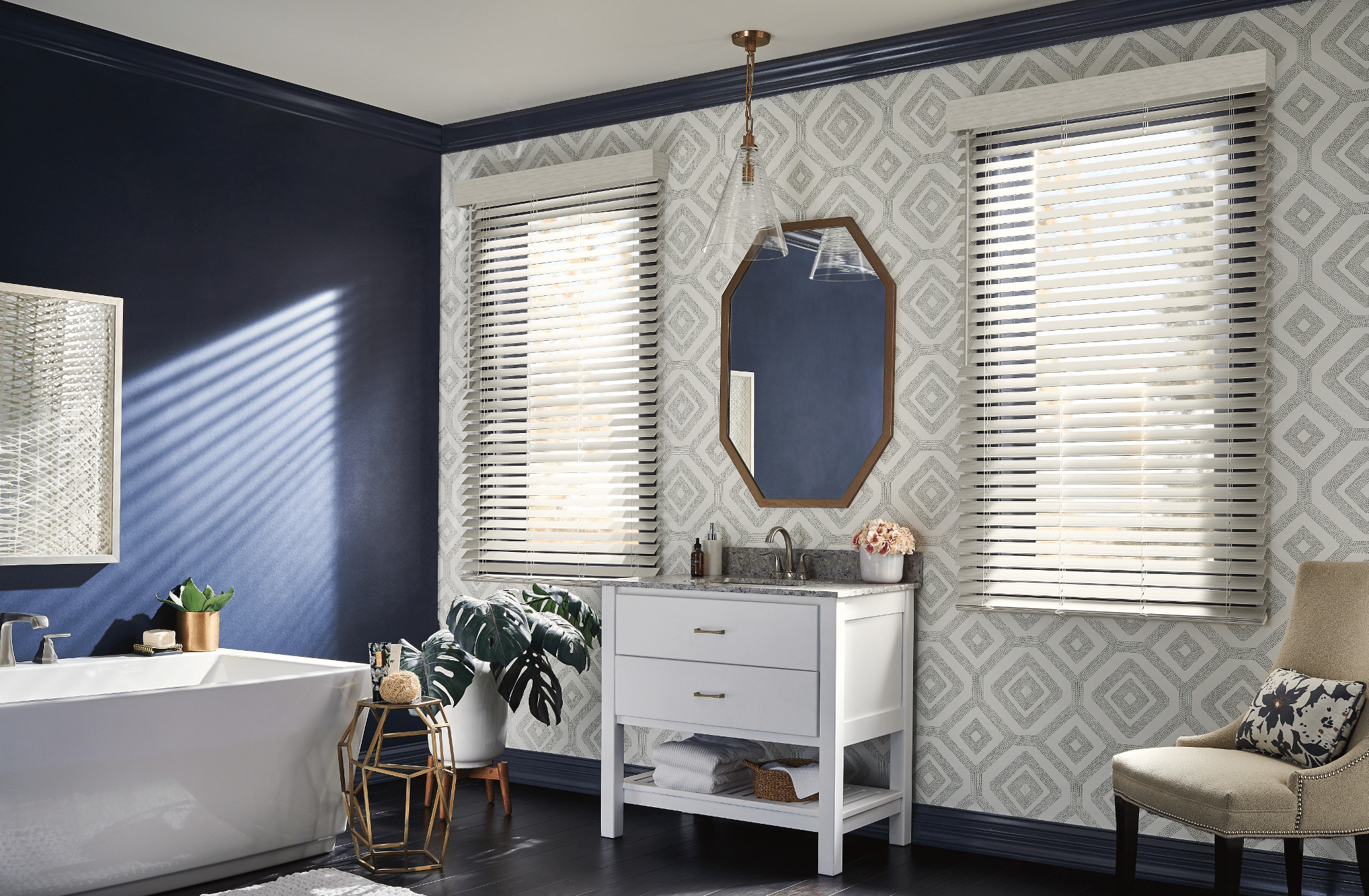 Custom Blinds filtering in light into a blue painted bathroom.